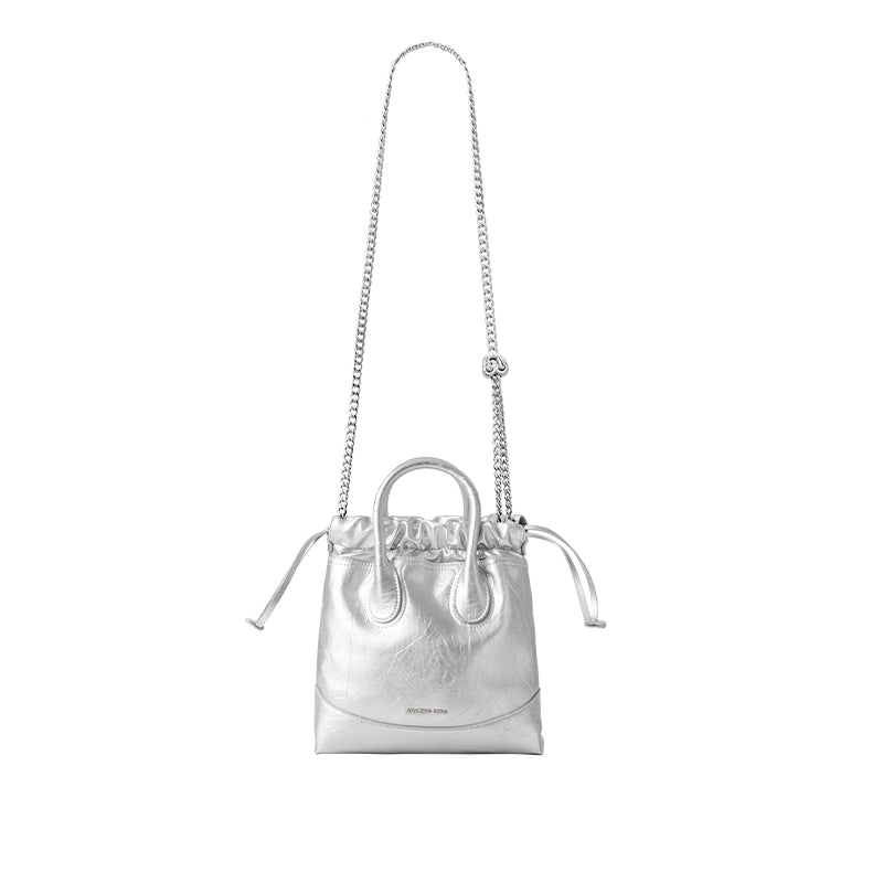 Silver metallic handbag with chain strap, drawstring closure, and Amazing Song branding.