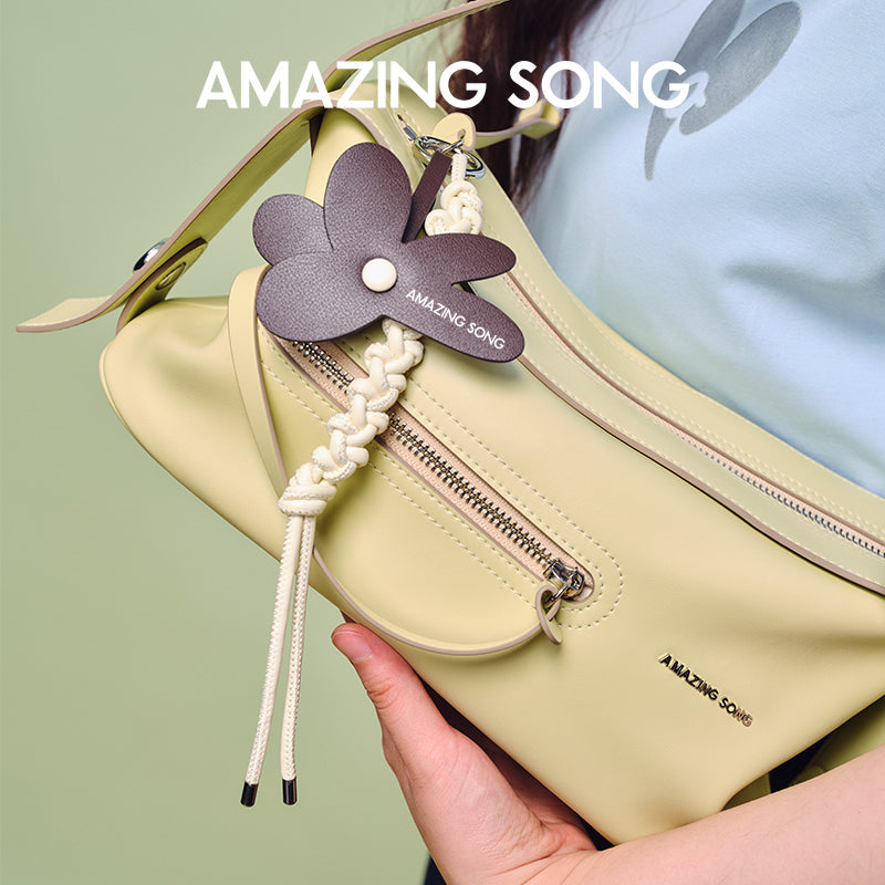 Amazing Song yellow shoulder bag with zipper pocket and flower keychain