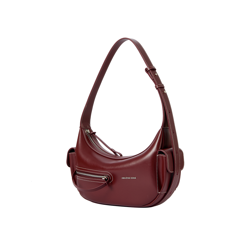 Amazing Song burgundy leather shoulder bag with front zipper pocket on white background