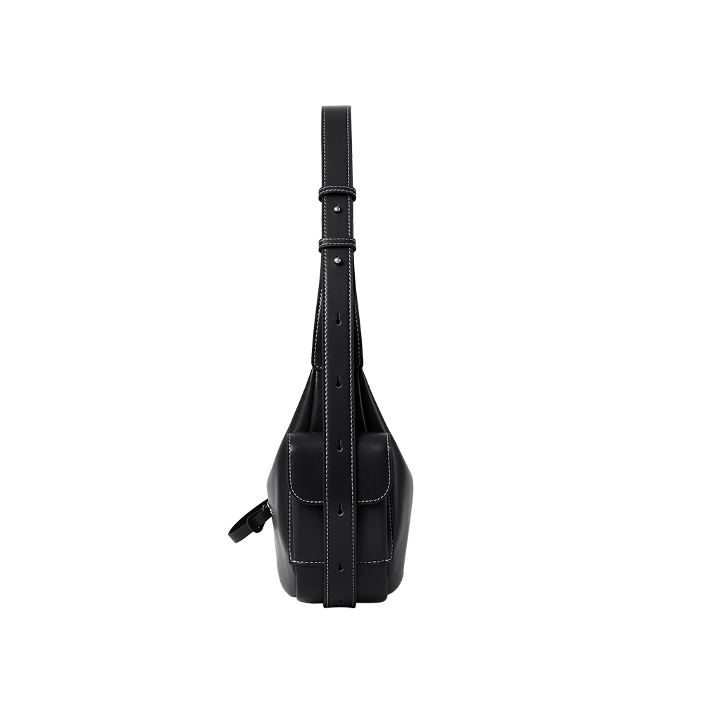 Black leather sling bag with white stitching, side view, on white background, Amazing Song