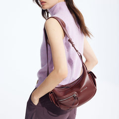 Woman wearing sleeveless lavender top with maroon leather shoulder bag, Amazing Song