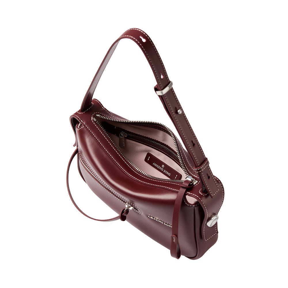 Amazing Song burgundy leather shoulder bag with zipper, white stitching, and logo detail