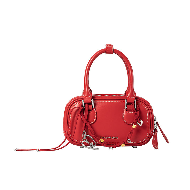 Amazing Song red leather handbag with double handles and decorative charms