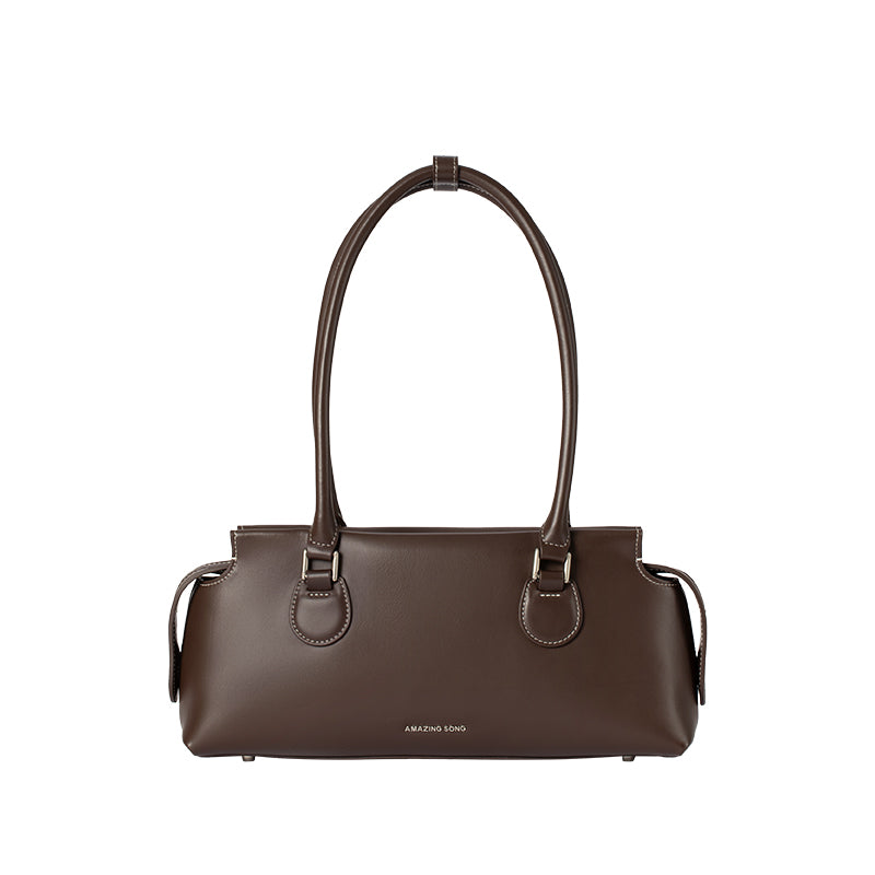 Amazing Song brown leather handbag with dual handles on white background