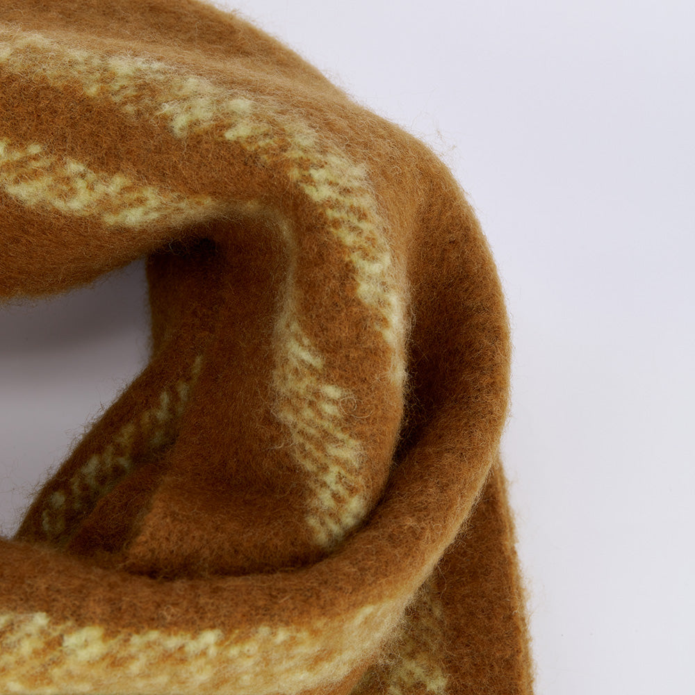 Close-up of a fuzzy brown and cream wool scarf, Amazing Song official website